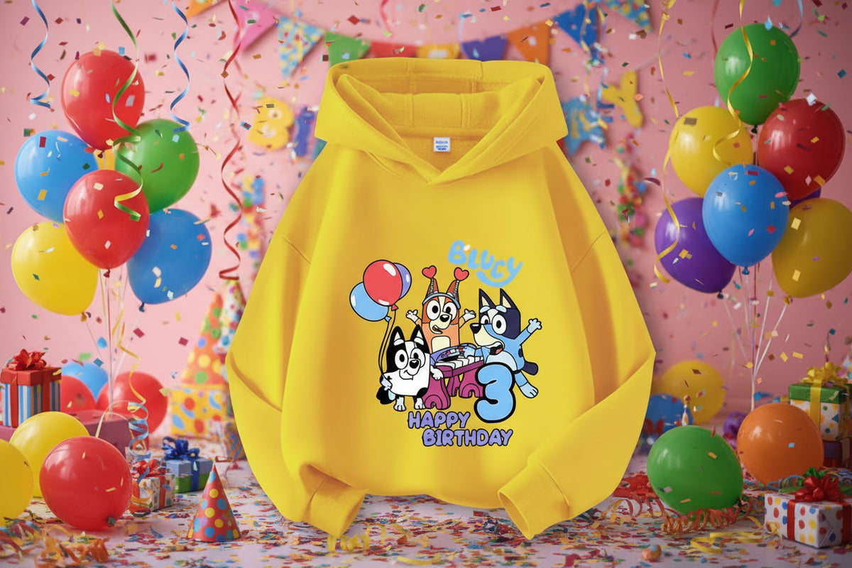 Yellow hoodie with cartoon characters and 'Happy Birthday' text on a green background